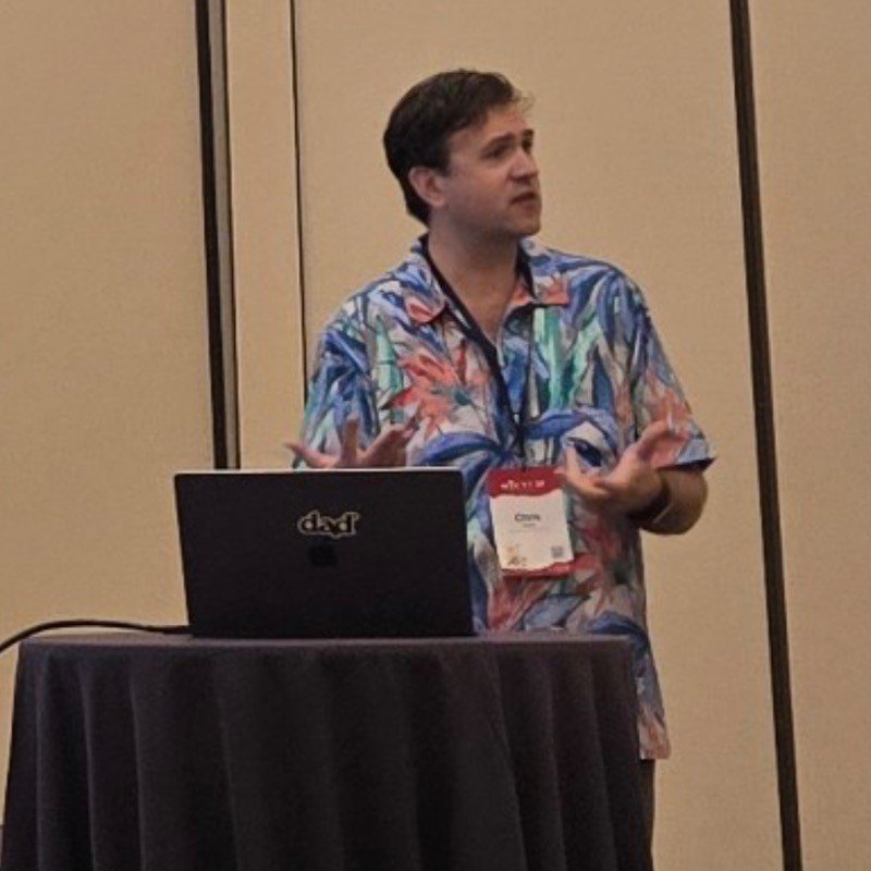 Chris J. Vargo presenting research at HICSS 2025.